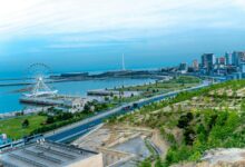 A beautiful cityscape view with a ferris wheel.