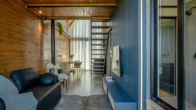 Modern living room with wooden walls and stairs
