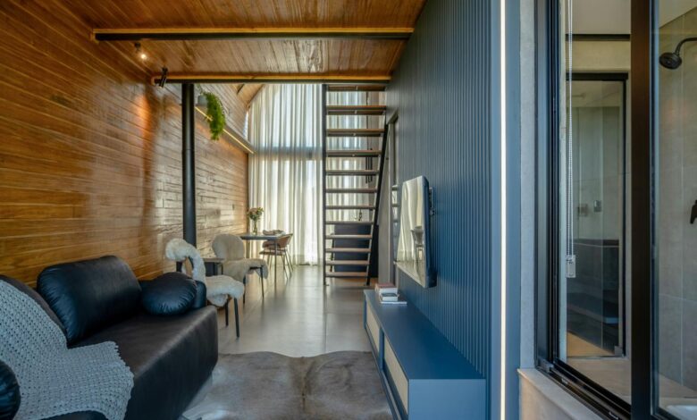 Modern living room with wooden walls and stairs