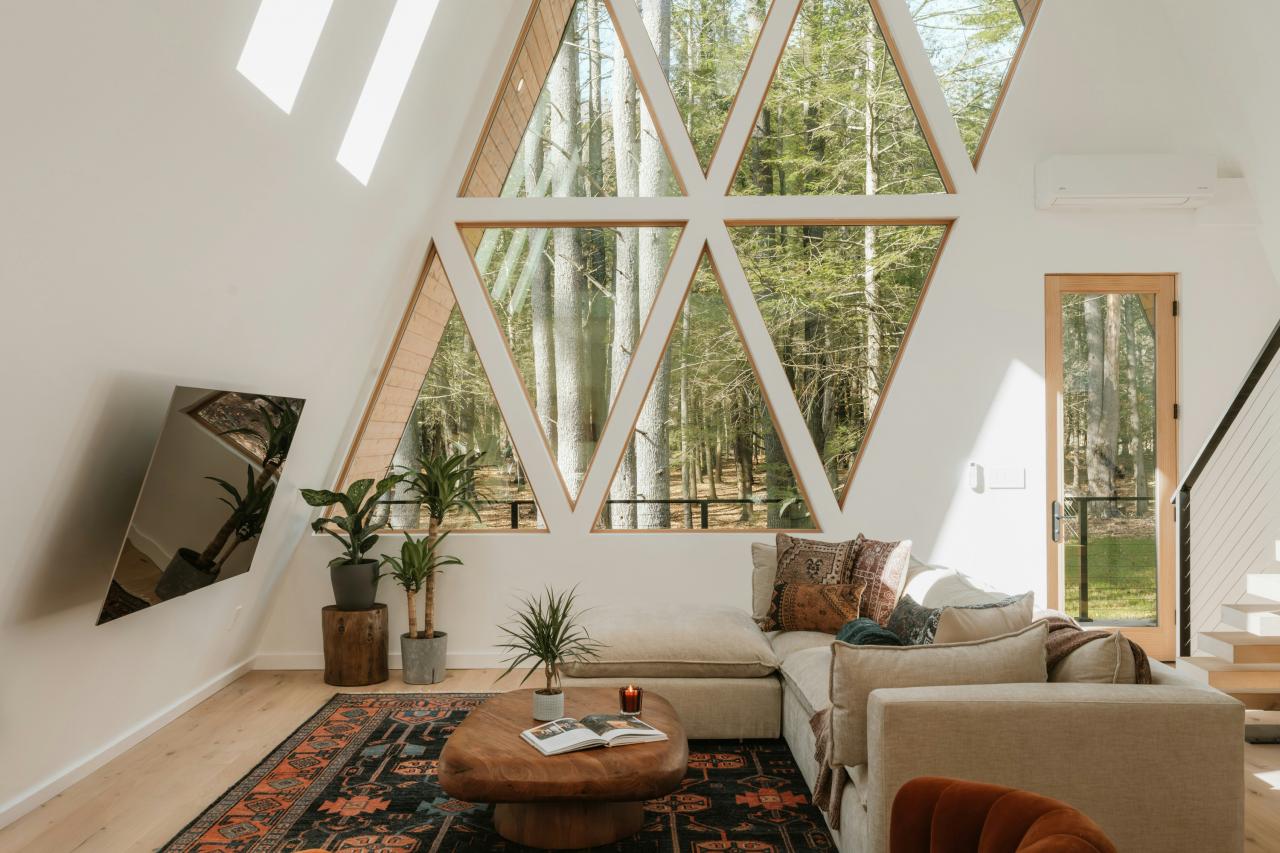 Modern a-frame living room with forest view